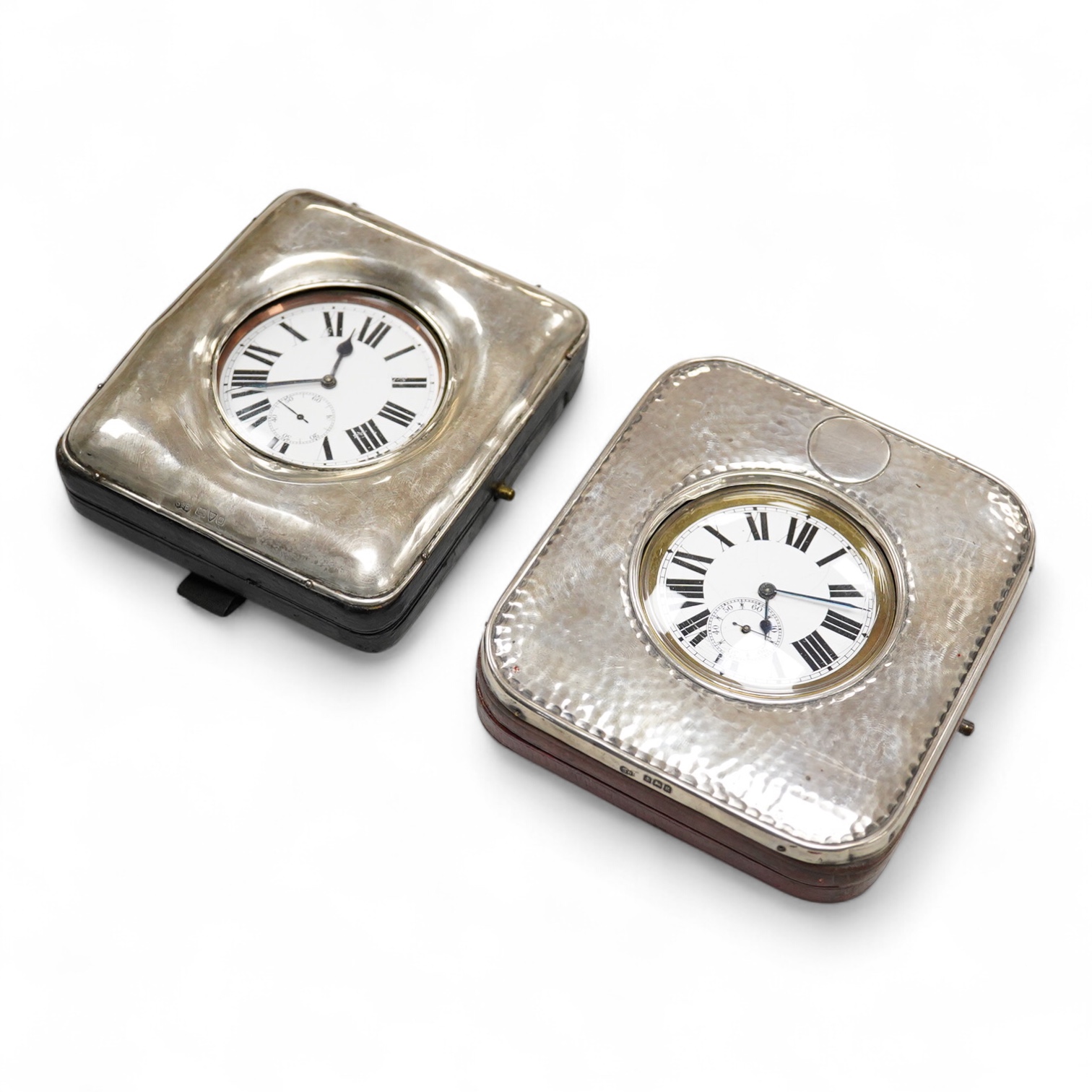 Two Edwardian silver mounted leather travelling watch cases, Chester 1905 and Birmingham, 1907, both containing a chrome cased keyless pocket watch.